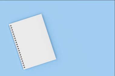 Mavi arka plan üzerinde bağlı kapalı defter spiral