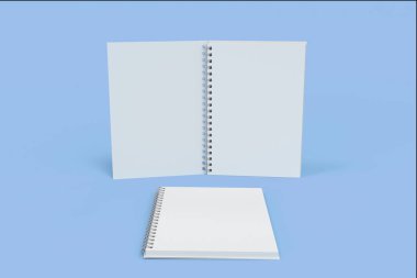 İki defter spiral ile mavi arka plan üzerinde bağlı