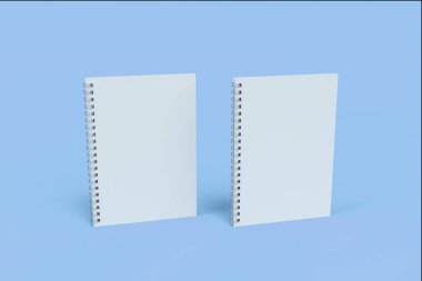 İki defter spiral ile mavi arka plan üzerinde bağlı