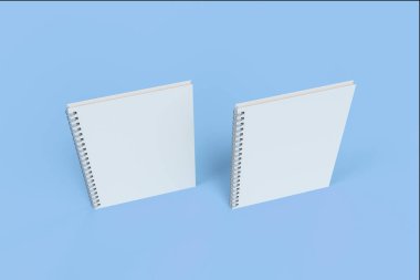 İki defter spiral ile mavi arka plan üzerinde bağlı