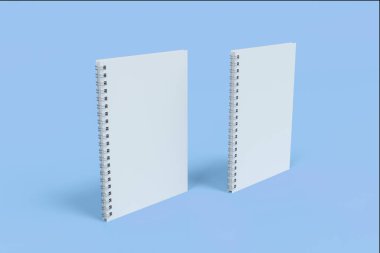 İki defter spiral ile mavi arka plan üzerinde bağlı