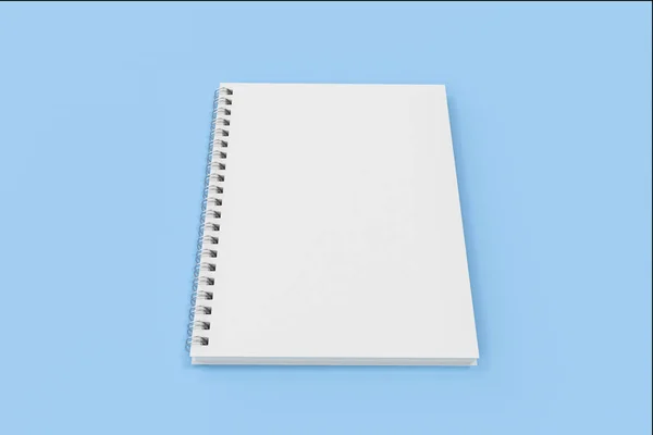 Chiuso notebook spirale rilegato su sfondo blu — Foto Stock