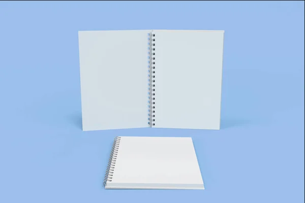 Dos cuadernos con espiral encuadernada sobre fondo azul — Foto de Stock