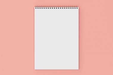 Kırmızı zemin üzerine beyaz boş defter metal spiral ile bağlı