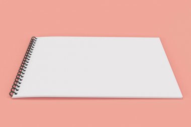 Kırmızı zemin üzerine beyaz boş defter siyah sarmal ile bağlı