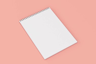 Kırmızı zemin üzerine beyaz boş defter metal spiral ile bağlı