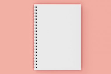 Kapalı defter spiral kırmızı zemin üzerine bağlı