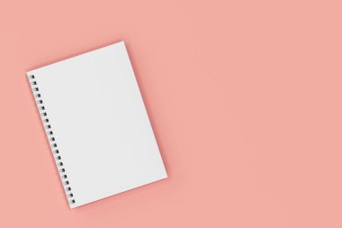 Kapalı defter spiral kırmızı zemin üzerine bağlı