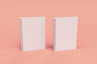 Kırmızı zemin üzerine iki defter spiral ile bağlı