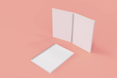 Kırmızı zemin üzerine iki defter spiral ile bağlı