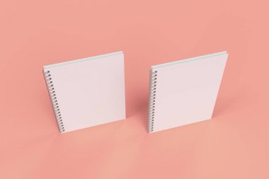 Kırmızı zemin üzerine iki defter spiral ile bağlı