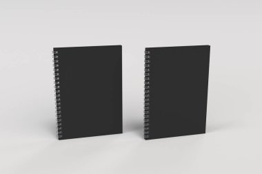 Beyaz arka plan üzerinde iki defter spiral ile bağlı