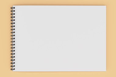 Portakal adam boş beyaz defter siyah sarmal ile bağlı