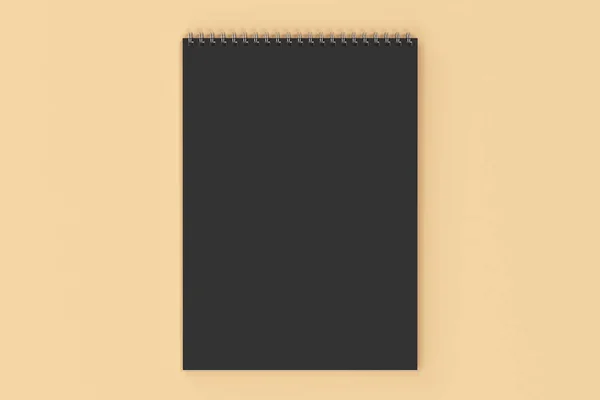 Caderno preto em branco com espiral de metal encadernado no fundo laranja — Fotografia de Stock