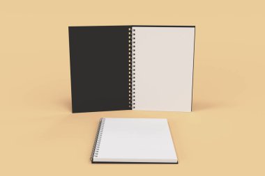 Turuncu zemin üzerine iki defter spiral ile bağlı