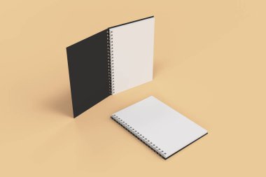 Turuncu zemin üzerine iki defter spiral ile bağlı