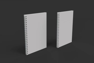 Siyah arka plan üzerine iki defter spiral ile bağlı