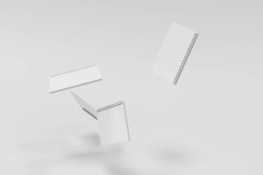 Beyaz arka plan üzerinde dört defter spiral ile bağlı