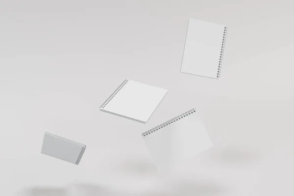Beyaz arka plan üzerinde dört defter spiral ile bağlı