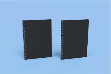 İki defter spiral ile mavi arka plan üzerinde bağlı