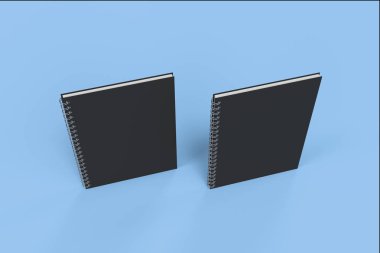 İki defter spiral ile mavi arka plan üzerinde bağlı