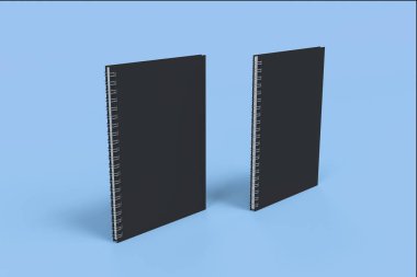 İki defter spiral ile mavi arka plan üzerinde bağlı