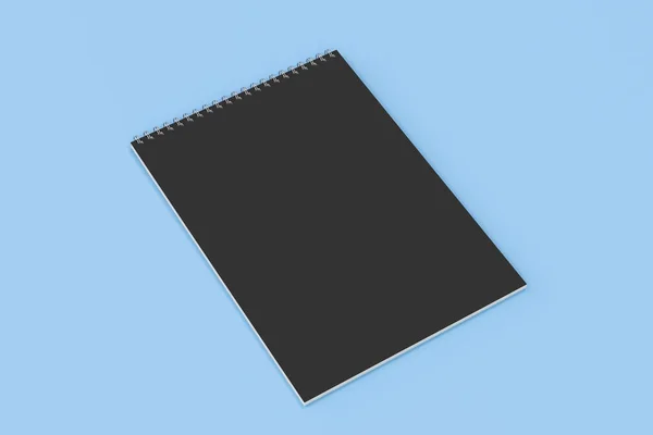Caderno preto em branco com espiral de metal encadernado no fundo azul — Fotografia de Stock