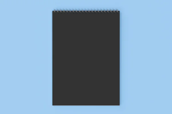 Cuaderno negro en blanco con espiral metálica encuadernada sobre fondo azul — Foto de Stock