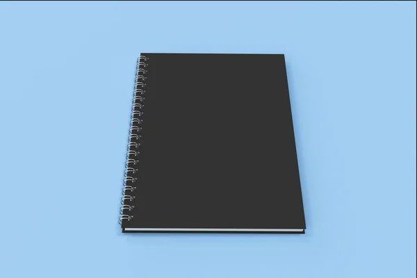 Закритий ноутбук спіраль, прив'язаний на синьому фоні — стокове фото
