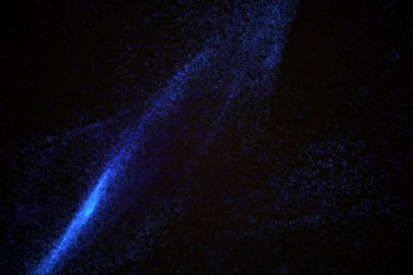 Arka plan mavi parlak parçacıkların yapılmış