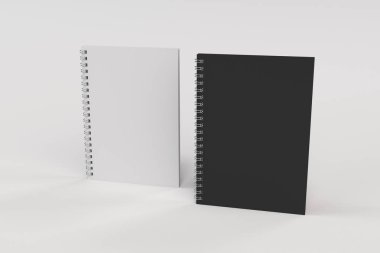Beyaz arka plan üzerinde iki defter spiral ile bağlı