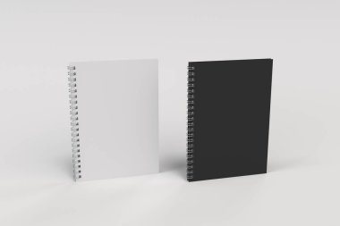 Beyaz arka plan üzerinde iki defter spiral ile bağlı