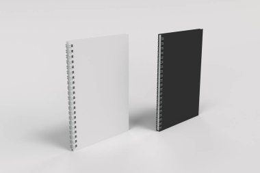 Beyaz arka plan üzerinde iki defter spiral ile bağlı
