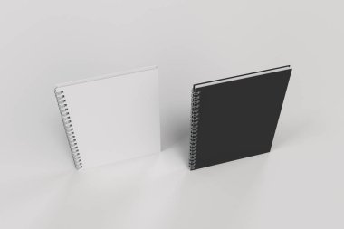Beyaz arka plan üzerinde iki defter spiral ile bağlı