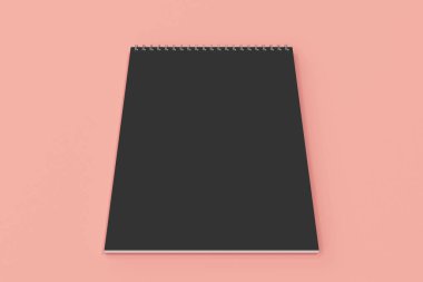 Kırmızı zemin üzerine boş siyah defter metal spiral ile bağlı