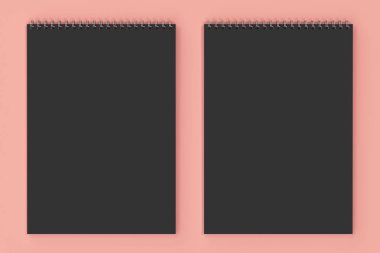 Kırmızı zemin üzerine boş siyah defter metal spiral ile bağlı