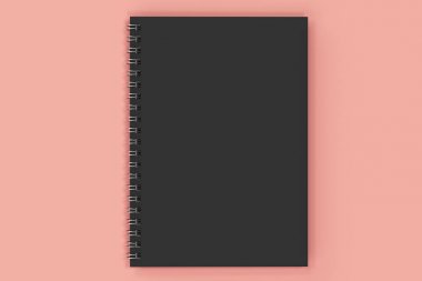 Kapalı defter spiral kırmızı zemin üzerine bağlı