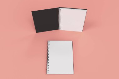 Kırmızı zemin üzerine iki defter spiral ile bağlı