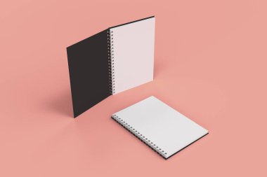 Kırmızı zemin üzerine iki defter spiral ile bağlı