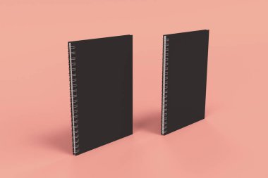 Kırmızı zemin üzerine iki defter spiral ile bağlı