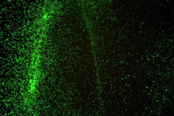 Arka plan yeşil parlayan parçacıkların yapılmış