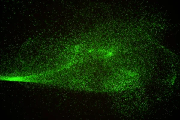 Arka plan yeşil parlayan parçacıkların yapılmış