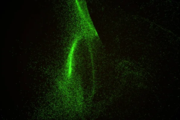 Arka plan yeşil parlayan parçacıkların yapılmış