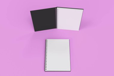 Menekşe arka plan üzerinde iki defter spiral ile bağlı