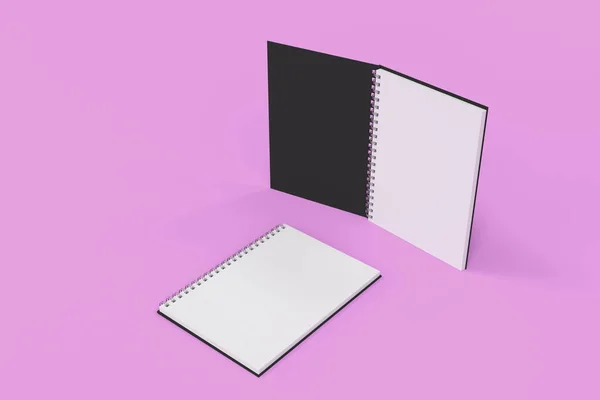 Twee laptops met spiraal gebonden op violette achtergrond — Stockfoto