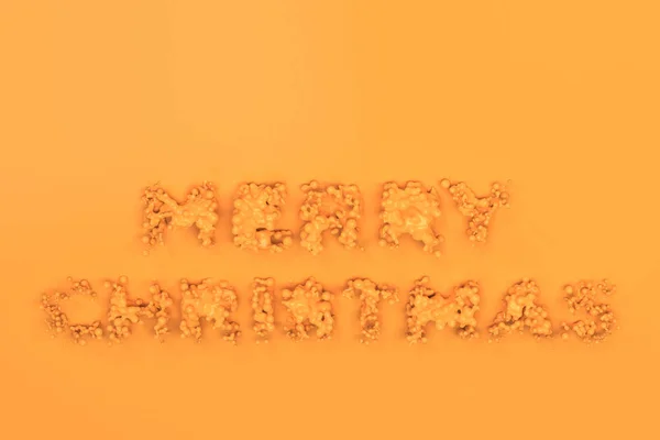 Liquid orange Merry Christmas words with drops on orange backgro