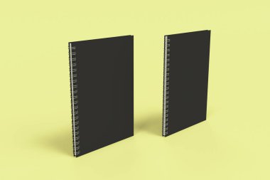 Sarı arka plan üzerinde iki defter spiral ile bağlı