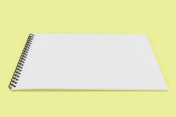 Κενή άσπρη σημειωματάριο με μαύρο σπιράλ σε κίτρινο backgroun — Φωτογραφία Αρχείου