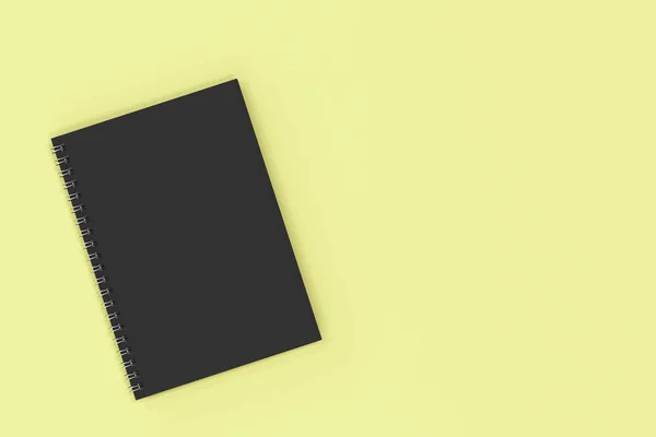 Stängda anteckningsbok spiral bunden på gul bakgrund — Stockfoto