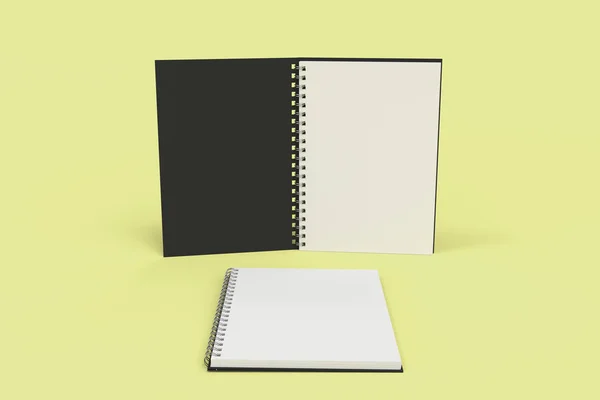 Dois cadernos com espiral encadernada no fundo amarelo — Fotografia de Stock